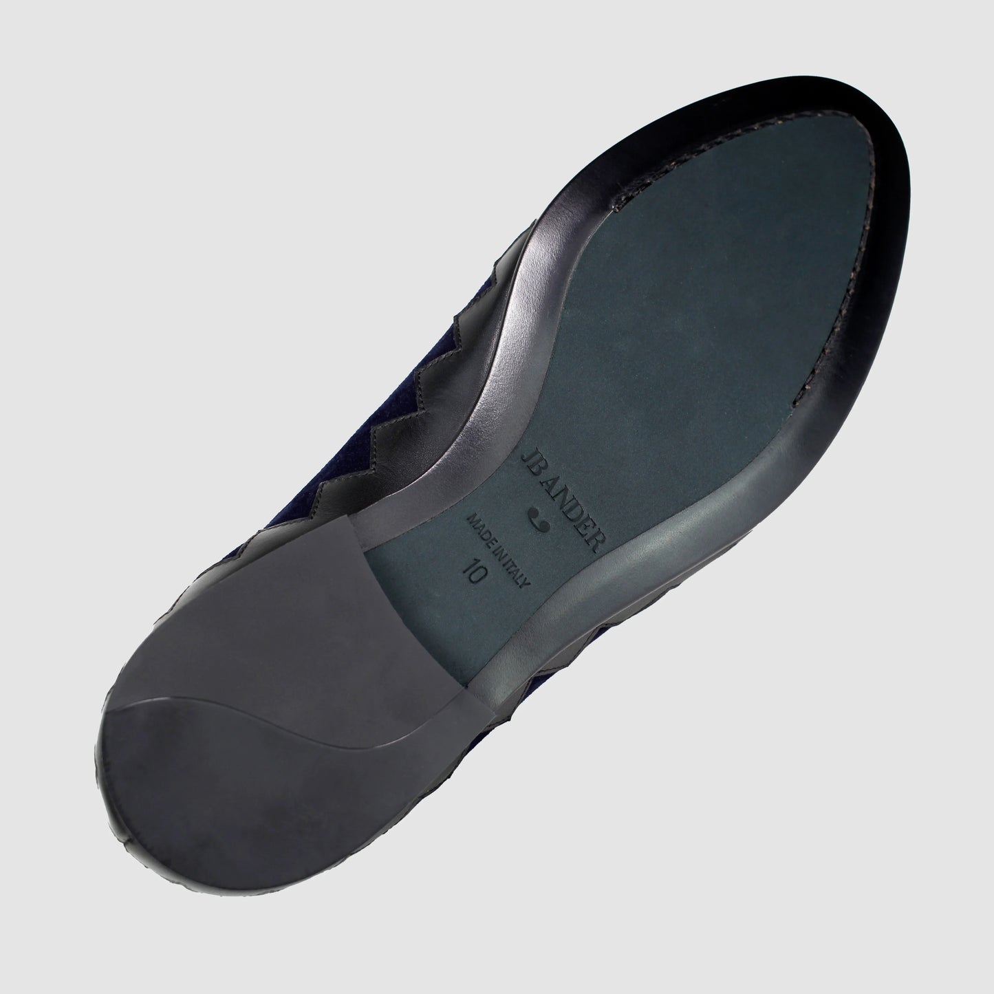 Leather sole of the JB Ander Great White smoking slipper loafers in Marino navy suede, showing polished black leather edge, 'Made in Italy' detail, and slim rubber heel for comfort and grip.