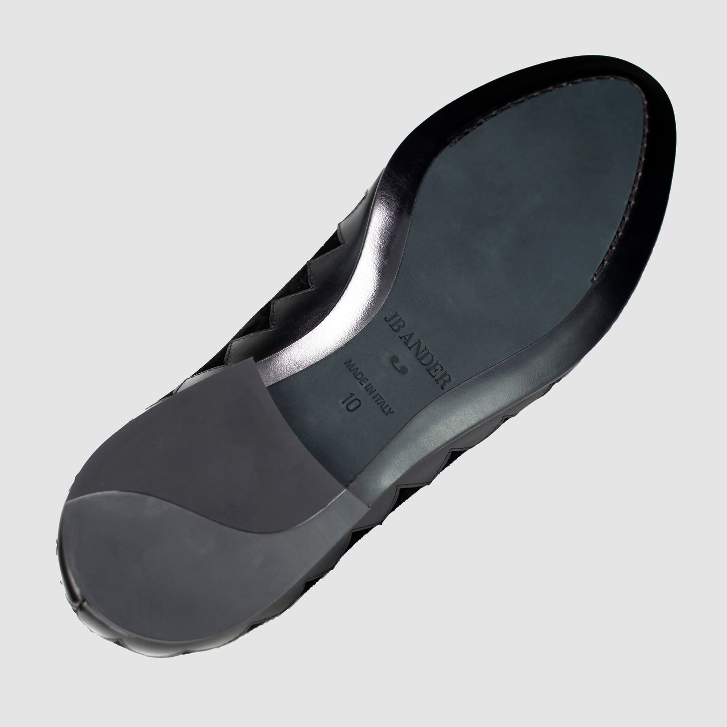 Leather sole of the JB Ander Great White smoking slipper loafers in Nero black suede, showing polished black leather edge, 'Made in Italy' detail, and slim rubber heel for comfort and grip.