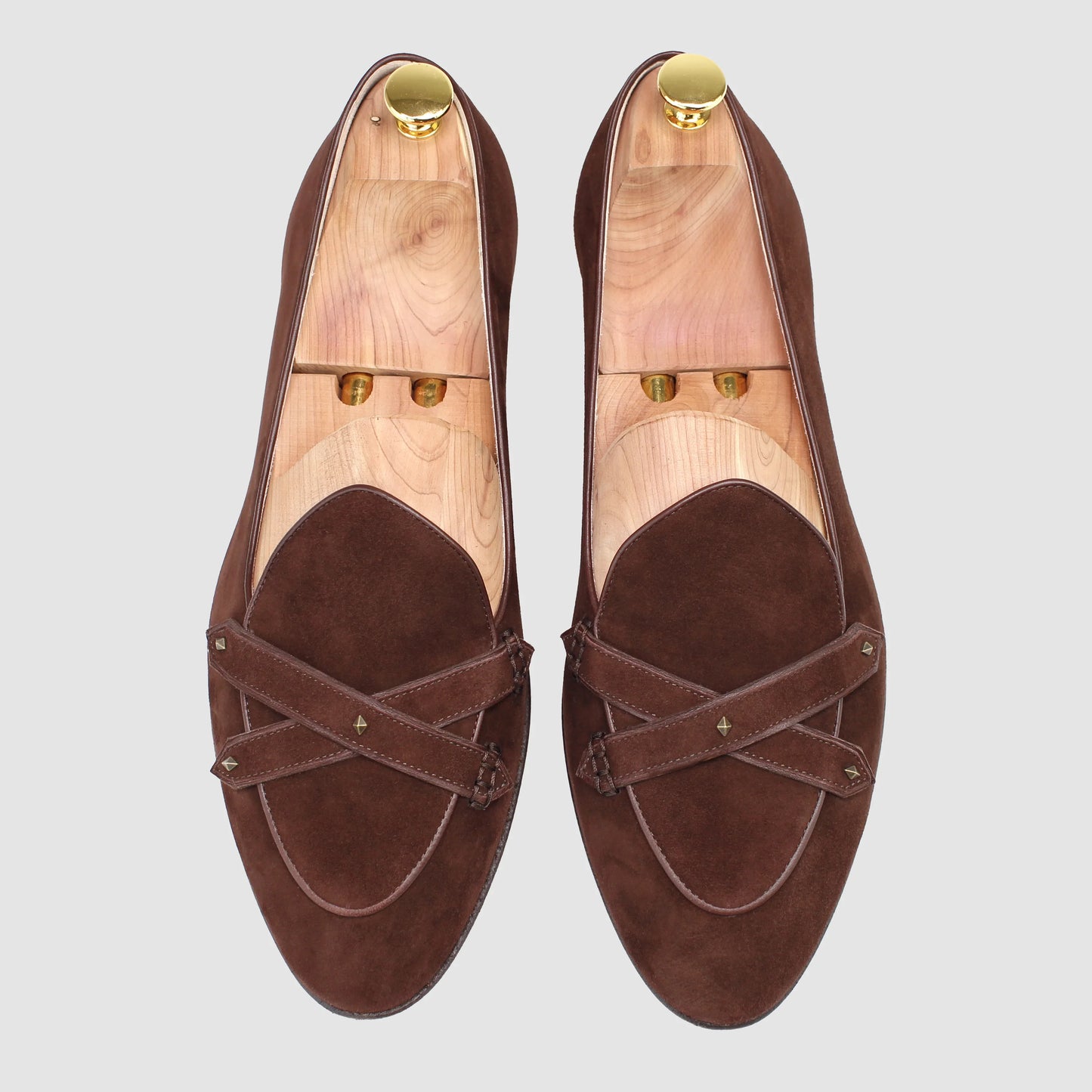 Overhead view of JB Ander men's Lincoln saddle loafers in brown suede with dual leather strap, antiqued gold metal accessories, and handmade Italian craftsmanship.