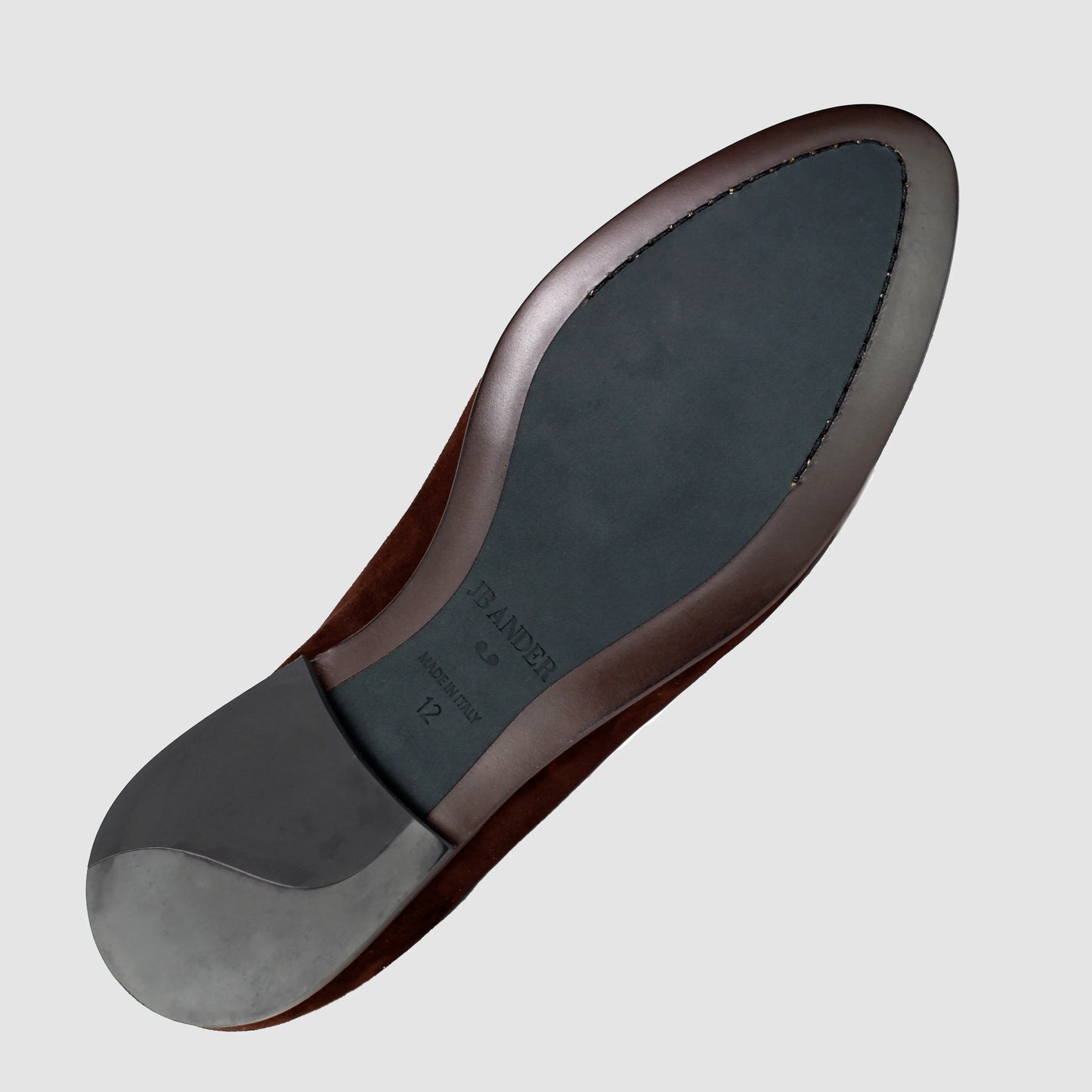 Leather sole of the JB Ander Lincoln saddle loafer in Brooklyn Brownstone brown suede, showing polished brown leather edge, 'Made in Italy' detail, and slim rubber heel for comfort and grip.