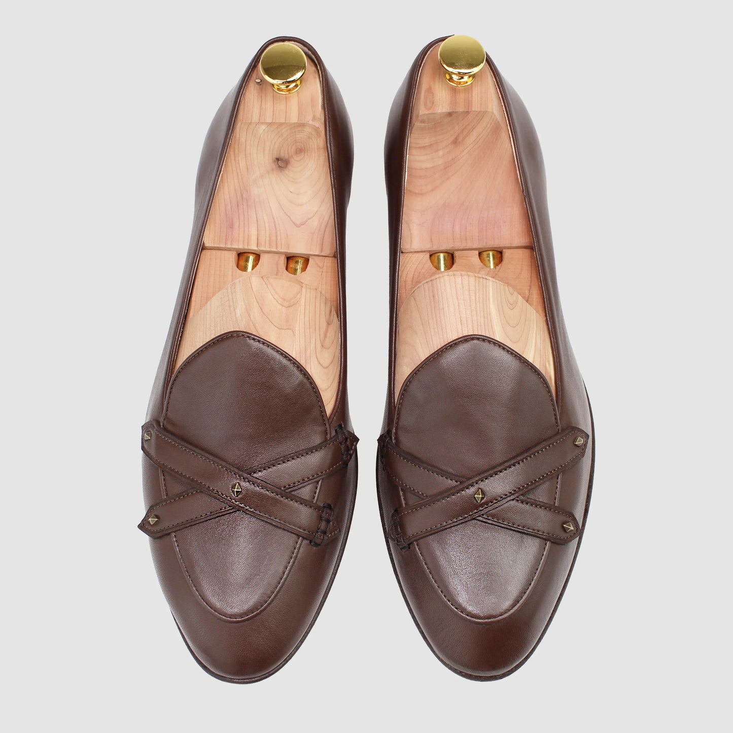 Overhead view of JB Ander men's Lincoln saddle loafers in chestnut brown leather with dual leather strap, antiqued gold metal accessories, and handmade Italian craftsmanship.