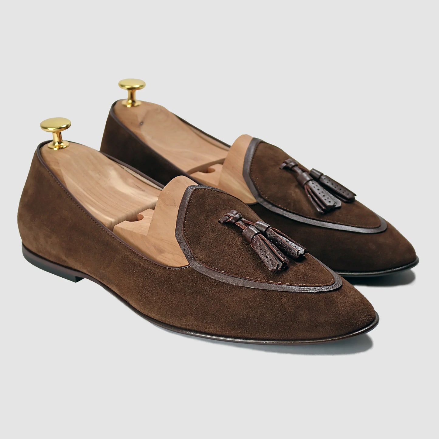 Pecan brown suede Valedictorian tassel loafers by JB Ander, featuring supple leather trim, minimalist slip-on design, and polished Italian craftsmanship.
