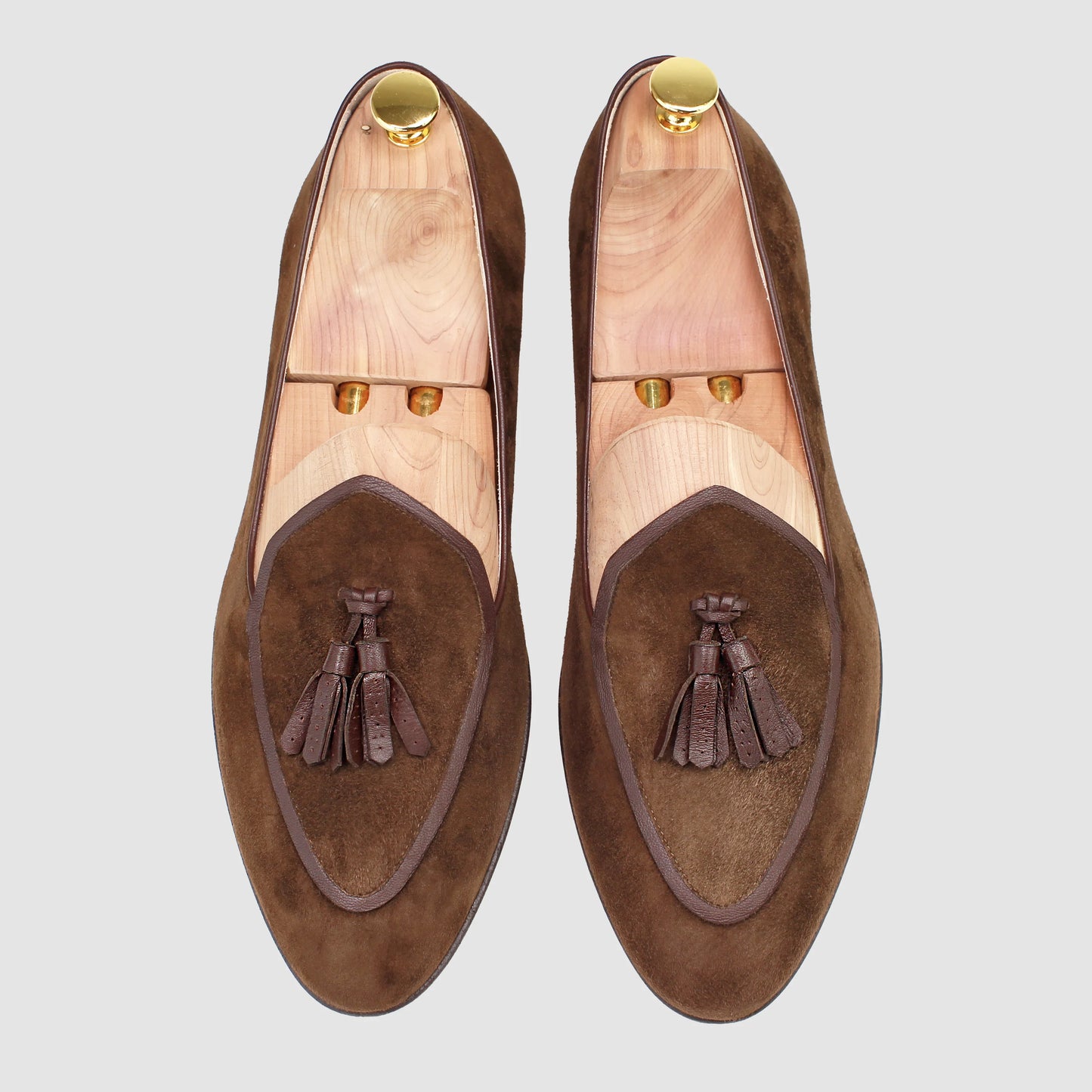 Overhead view of JB Ander men's Valedictorian tassel loafer in pecan brown suede with supple leather trim, and handmade Italian craftsmanship.