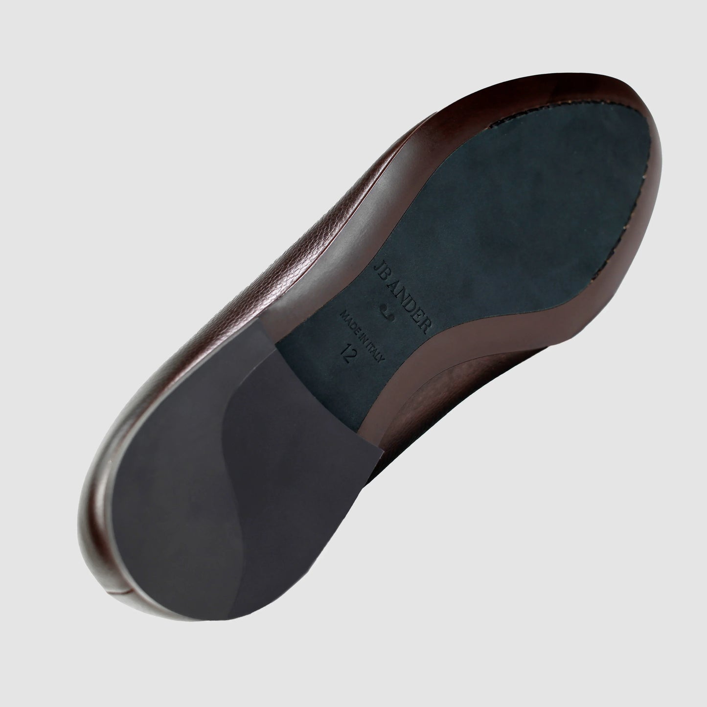 Leather sole of the JB Ander Vivaldi Venetian loafers in Espresso brown pebbled leather, showing polished brown leather edge, 'Made in Italy' detail, and slim rubber heel for comfort and grip.