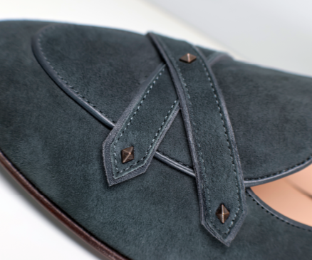 Closeup of JB Ander's Lincoln loafer in color Empire Emerald, featuring dual leather straps and unique antiqued gold hardware.
