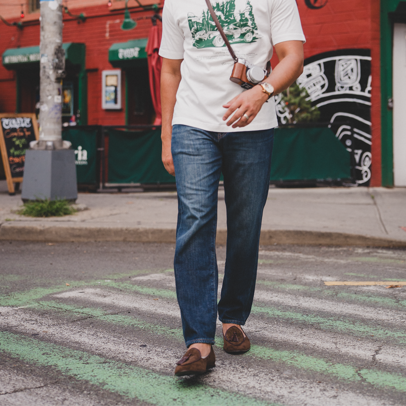 Model wearing JB Ander suede tassel loafers in chestnut brown, handmade in Italy