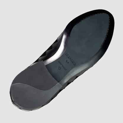 Leather sole of the JB Ander Great White smoking slipper loafers in Nero black suede, showing polished black leather edge, 'Made in Italy' detail, and slim rubber heel for comfort and grip.