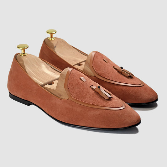 Terracotta suede Valedictorian tassel loafers by JB Ander, featuring supple leather trim, minimalist slip-on design, and polished Italian craftsmanship.