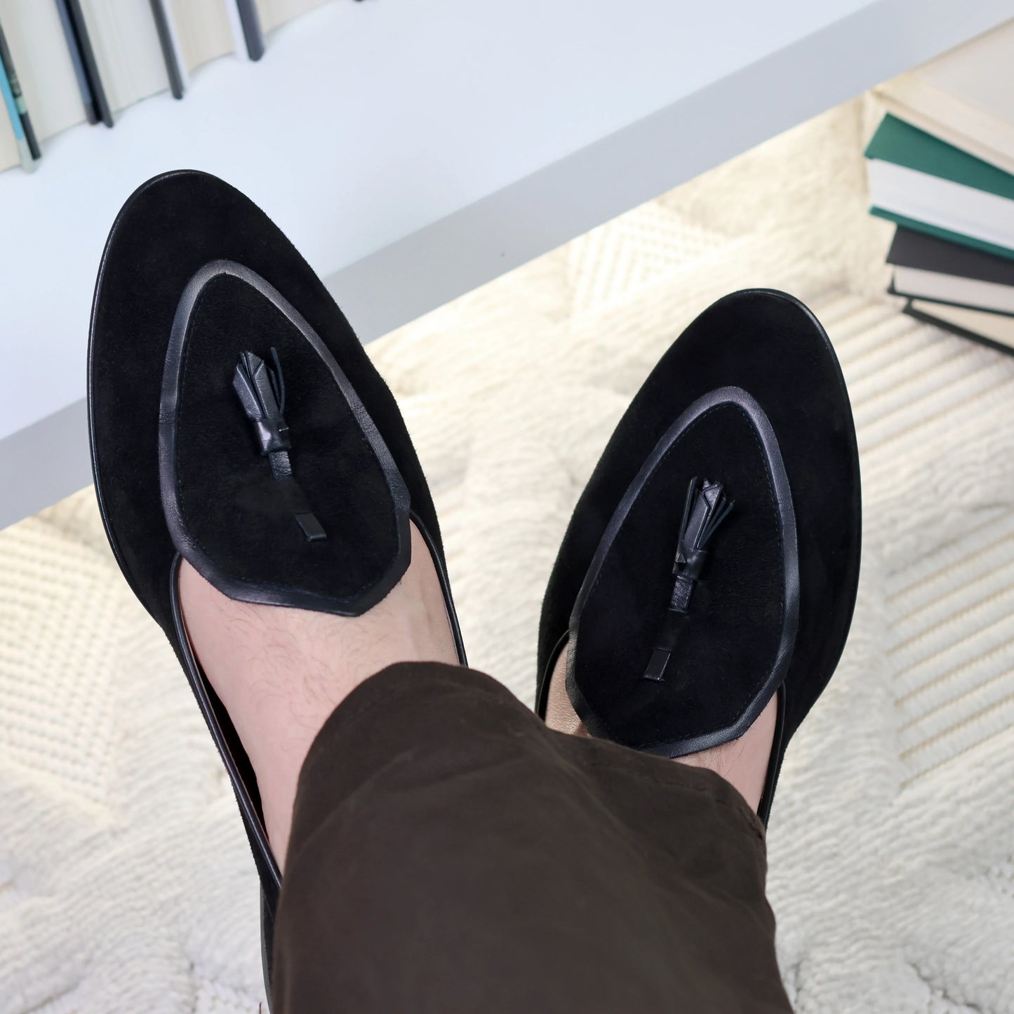 Model wearing JB Ander men's Valedictorian tassel loafers in black suede black brown leather trim, and handmade Italian craftsmanship.