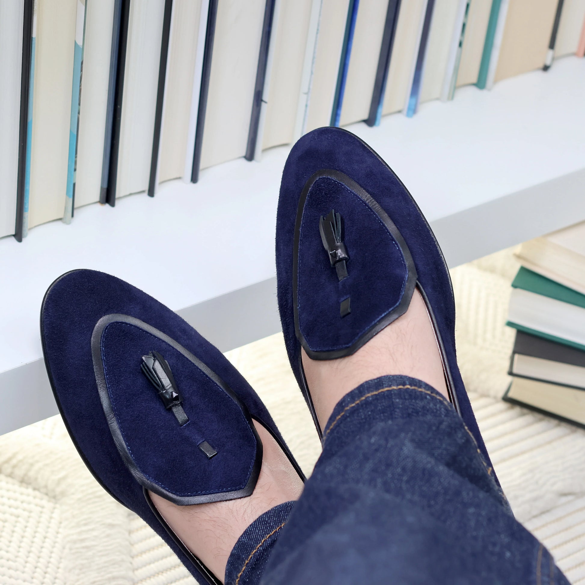 Model wearing JB Ander men's Valedictorian tassel loafers in Marino navy suede with black leather trim, and handmade Italian craftsmanship.