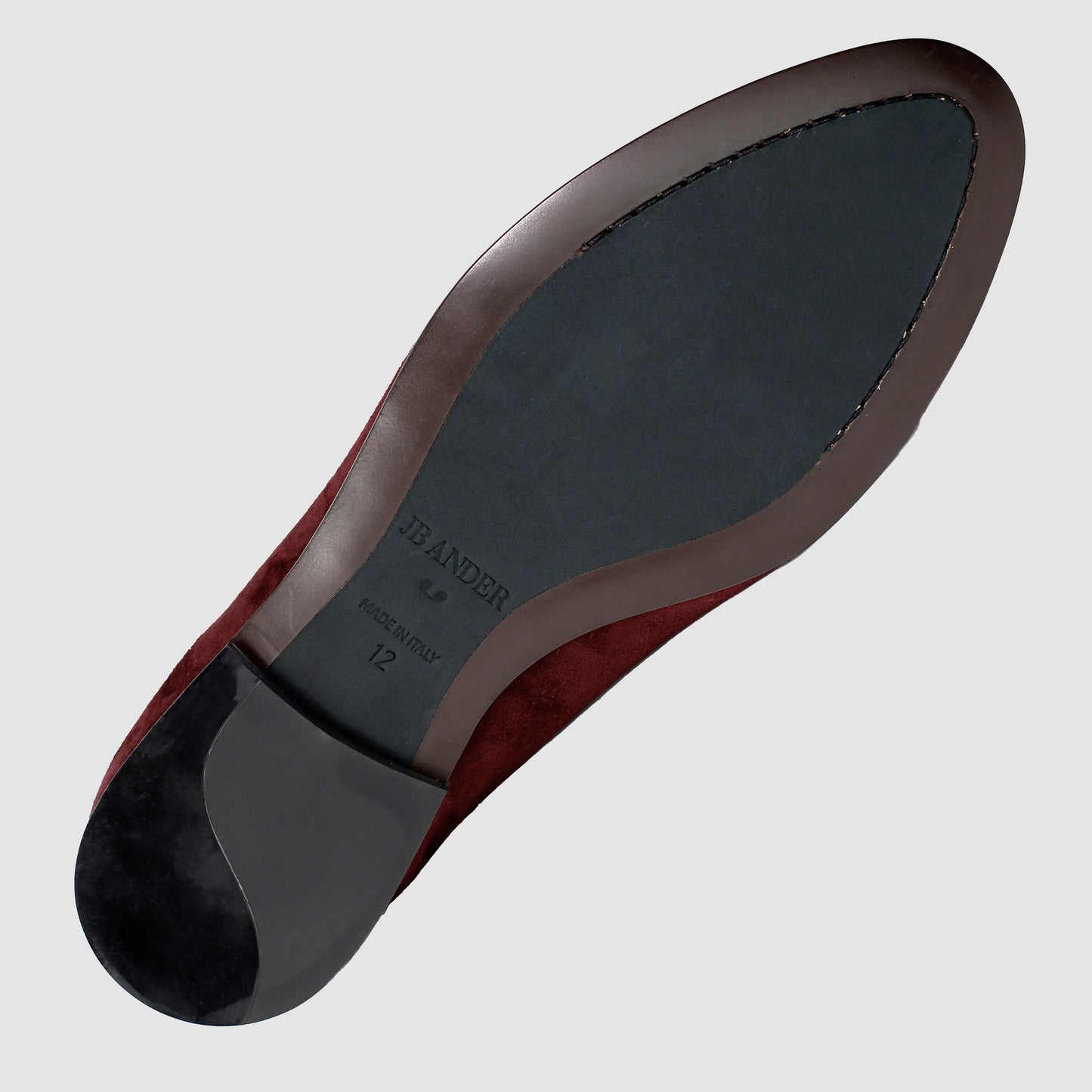 Leather sole of the JB Ander Vivaldi Venetian loafers in Broadway Bordeaux luxury suede, showing polished brown leather edge, 'Made in Italy' detail, and slim rubber heel for comfort and grip.