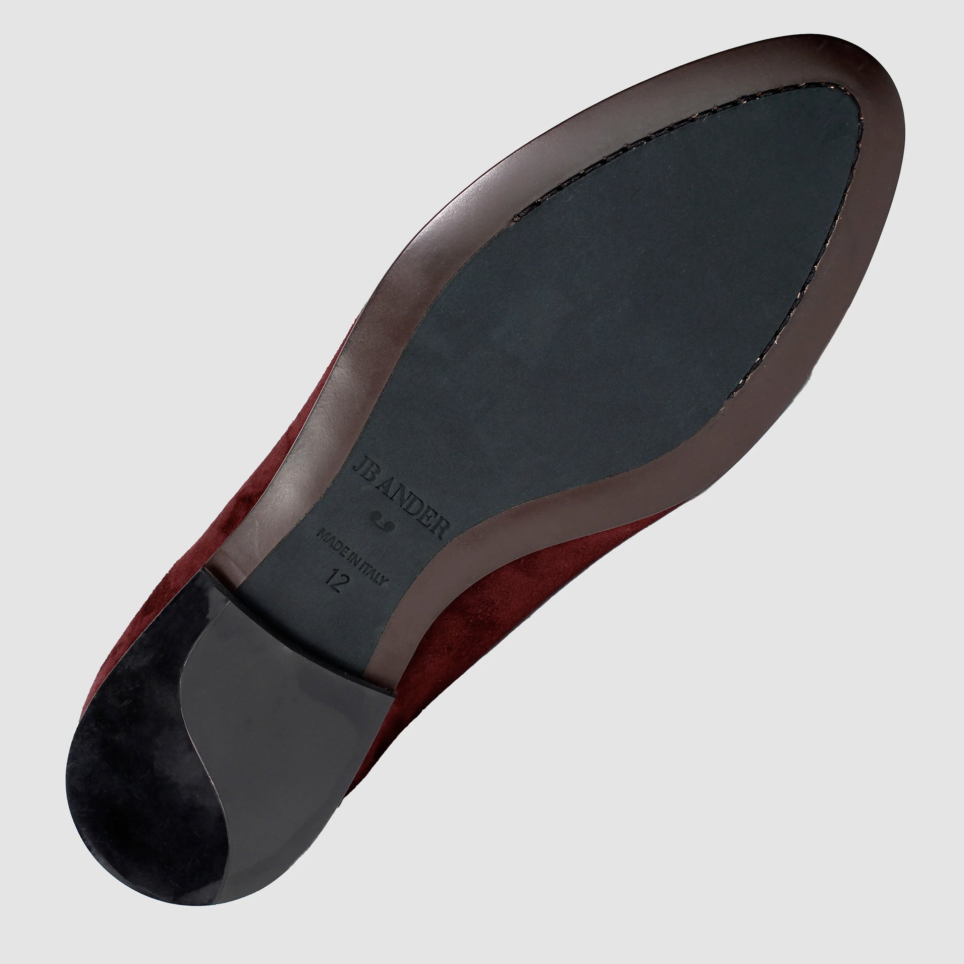 Leather sole of the JB Ander Vivaldi Venetian loafers in Broadway Bordeaux luxury suede, showing polished brown leather edge, 'Made in Italy' detail, and slim rubber heel for comfort and grip.
