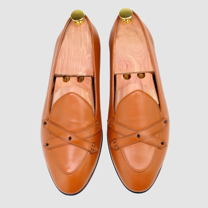 Overhead view of JB Ander men's Lincoln saddle loafers in terracotta leather with dual leather strap, metal accessories, and handmade Italian craftsmanship.