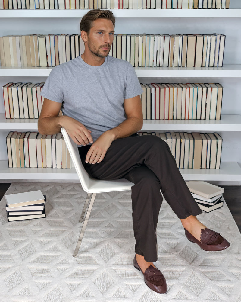 Model wearing JB Ander Scottie kilt loafer in brown leather and suede, showcasing fringe detail and handmade in Italy quality.