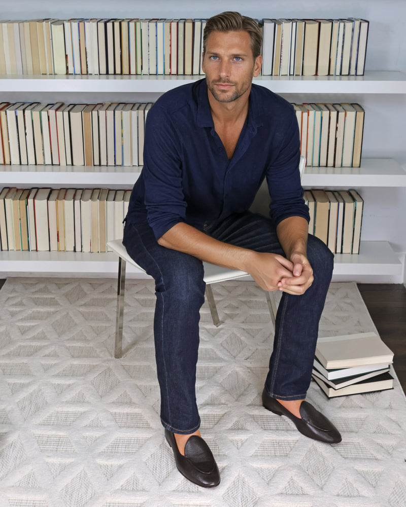 Model wearing JB Ander Venetian loafer in pebbled brown leather, showcasing versatile slip-on design detail and handmade in Italy quality.