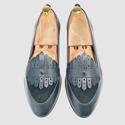 Overhead view of JB Ander men's Scottie kilt loafers in Verde green leather with dual leather fringe, suede trim, and handmade Italian craftsmanship.